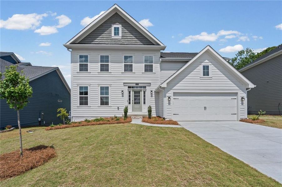 Front exterior of a new home in The Reserve At Liberty Park, Braselton, GA, highlighting curb appeal (Image 1). Front exterior of a new home in The Reserve At Liberty Park, Braselton, GA, highlighting curb appeal (Image 1).