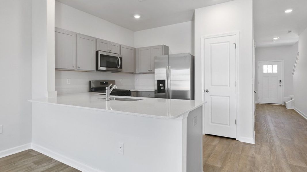 Furnished interior view inside a new home in The Townes at Bexford, Willow Spring (Image 3).