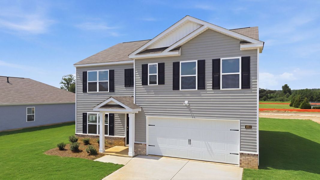 Front exterior of a new home in Bynum Farms, Farmville, NC, highlighting curb appeal (Image 2). Front exterior of a new home in Bynum Farms, Farmville, NC, highlighting curb appeal (Image 2).
