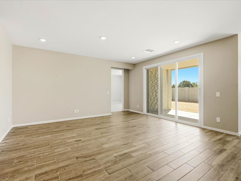 Spacious, unfurnished interior of a new home in White Tank Foothills Signature Series, Waddell (Image 10).