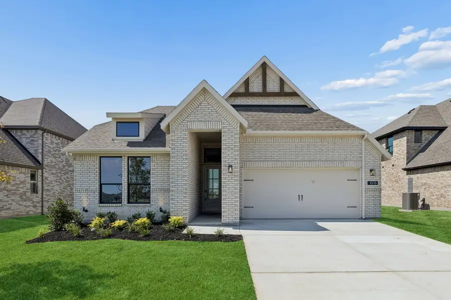 Front exterior of a new home in Parkmont – Timberbrook, Justin, TX, highlighting curb appeal (Image 1). Front exterior of a new home in Parkmont – Timberbrook, Justin, TX, highlighting curb appeal (Image 1).