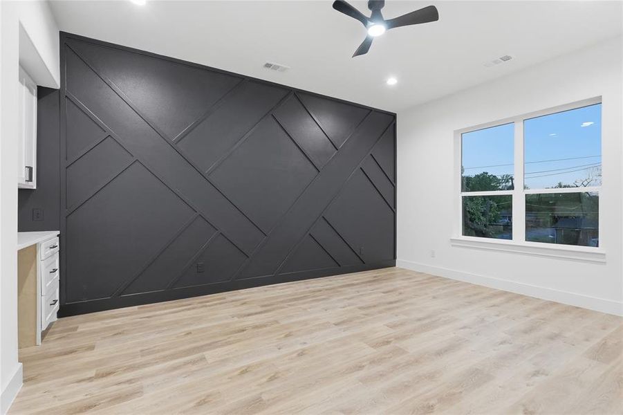 Unfurnished room with a decorative wall, ceiling fan, light wood-style floors, an accent wall, and recessed lighting