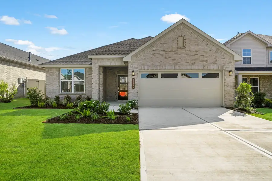 Front exterior of a new home in Audubon, Magnolia, TX, highlighting curb appeal (Image 1). Front exterior of a new home in Audubon, Magnolia, TX, highlighting curb appeal (Image 1).