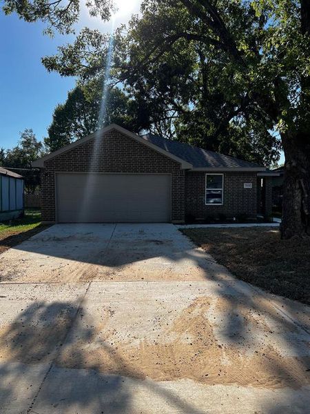 View of front of home featuring a garage