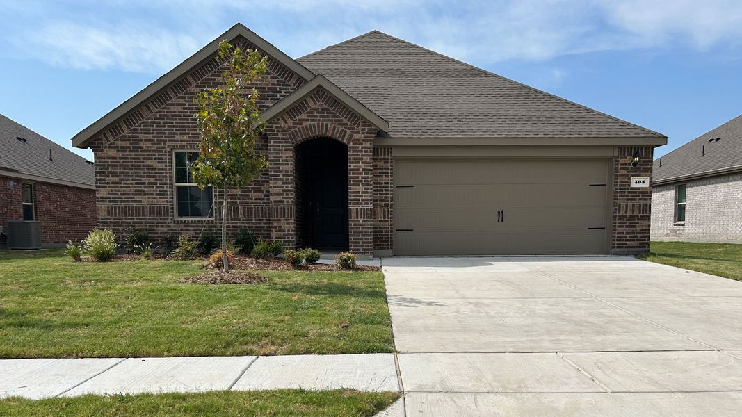 Front exterior of a new home in Trailstone, Caddo Mills, TX, highlighting curb appeal (Image 1). Front exterior of a new home in Trailstone, Caddo Mills, TX, highlighting curb appeal (Image 1).