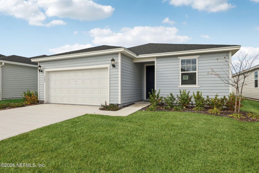 Front exterior of a new home in Lakes at Bella Lago - Signature Series, Green Cove Springs, FL, highlighting curb appeal (Image 1). Front exterior of a new home in Lakes at Bella Lago - Signature Series, Green Cove Springs, FL, highlighting curb appeal (Image 1).