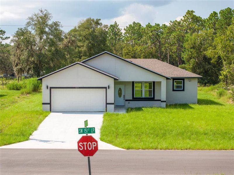 Front exterior of a new home in , Ocala, FL, highlighting curb appeal (Image 21). Front exterior of a new home in , Ocala, FL, highlighting curb appeal (Image 21).
