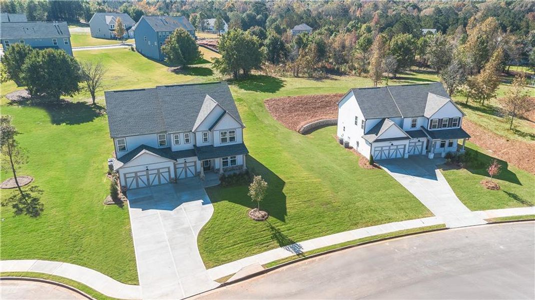 Front exterior of a new home in Wellington Estates, Madison, GA, highlighting curb appeal (Image 1). Front exterior of a new home in Wellington Estates, Madison, GA, highlighting curb appeal (Image 1).