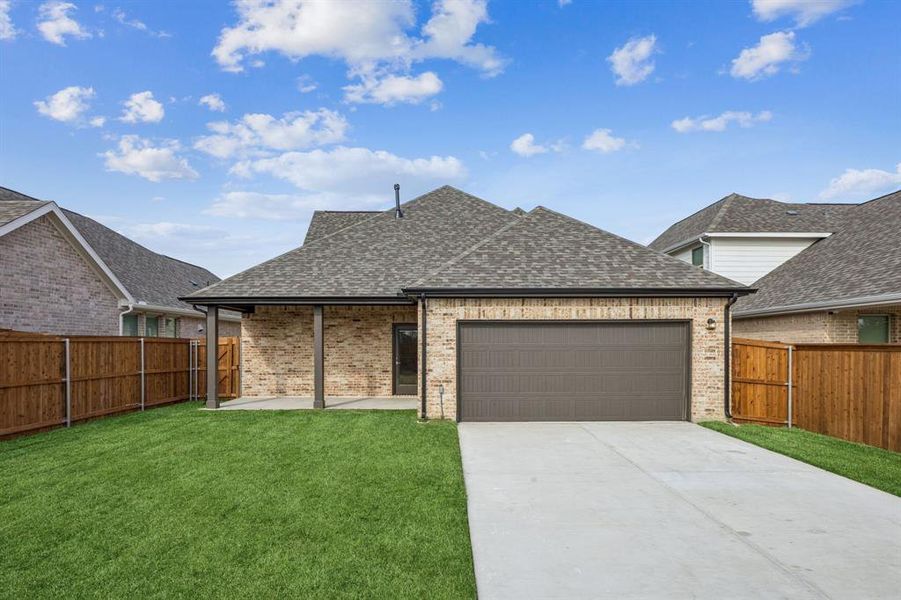 Front exterior of a new home in Dove Hollow, Waxahachie, TX, highlighting curb appeal (Image 18). Front exterior of a new home in Dove Hollow, Waxahachie, TX, highlighting curb appeal (Image 18).