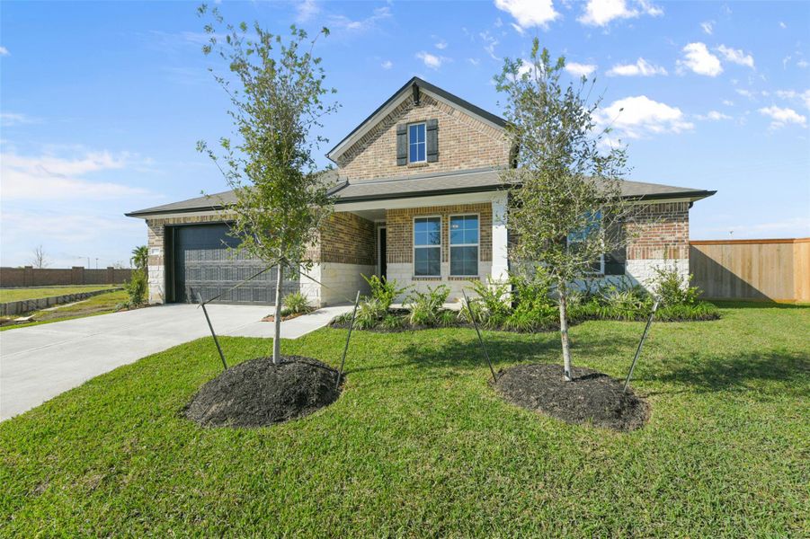 Front exterior of a new home in Lago Mar, Texas City, TX, highlighting curb appeal (Image 2).