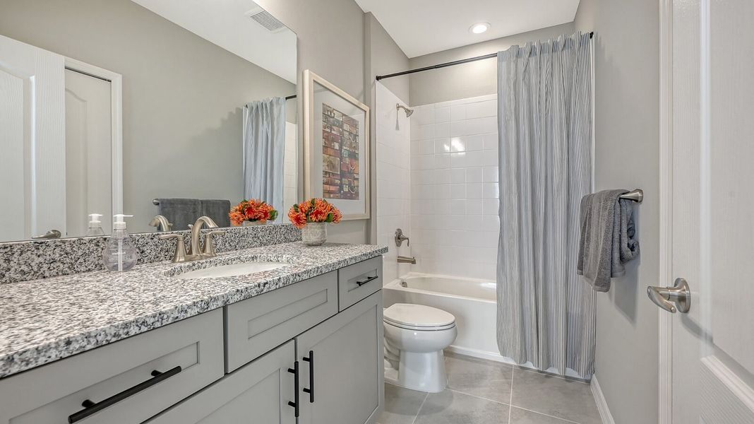 Representative furnished interior of a home built from the Morgan by Neal Communities in Grand Park, Sarasota (Image 34).