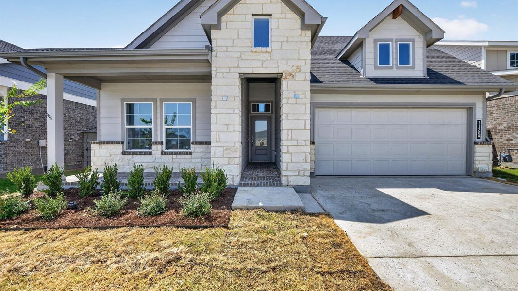Representative exterior photo of a completed home built from the Desert Willow by D.R. Horton in Treeline, Justin, TX (Image 22).