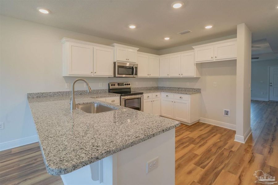Representative furnished interior of a home built from the Plan 1515 Cottage by Adams Homes in Turtle Creek, Cantonment (Image 4).