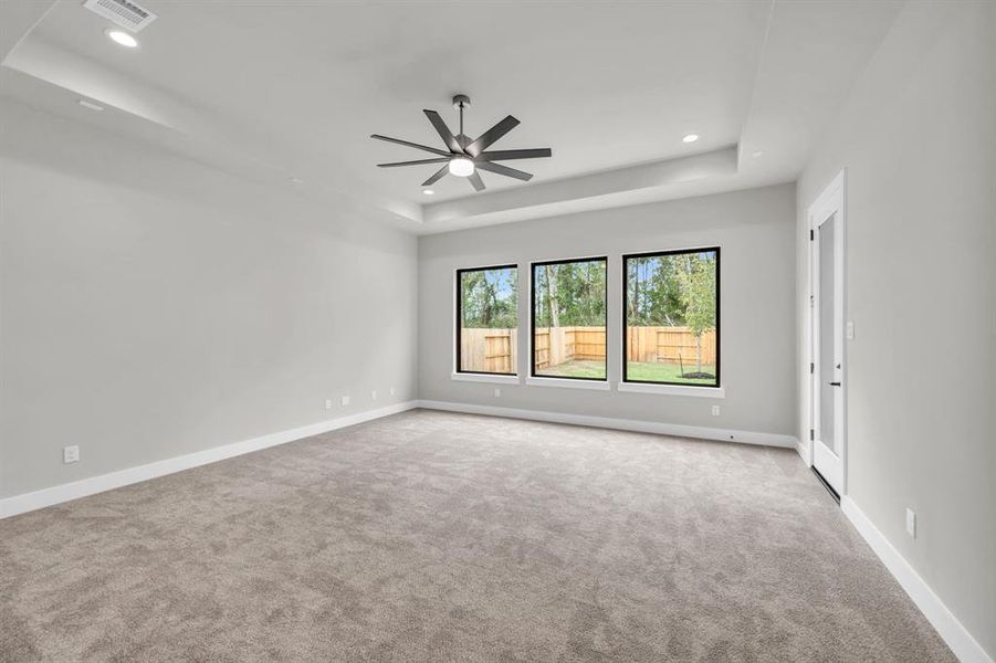 Gameroom with coffered ceiling and access to the covered patio