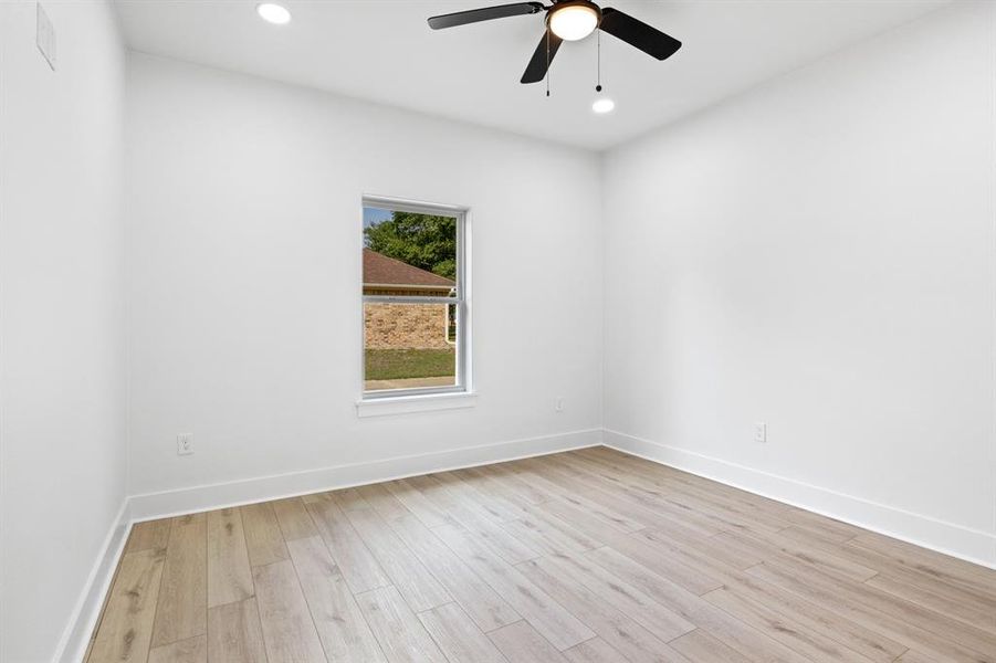 Spare room featuring light wood-style flooring, recessed lighting, and ceiling fan