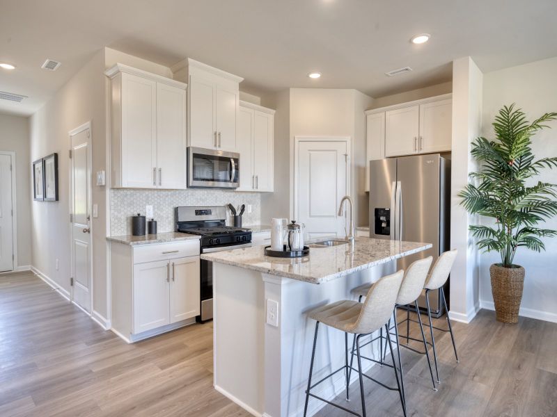 Kitchen in the Topaz floorplan at a Meritage Homes community in Graham, NC.