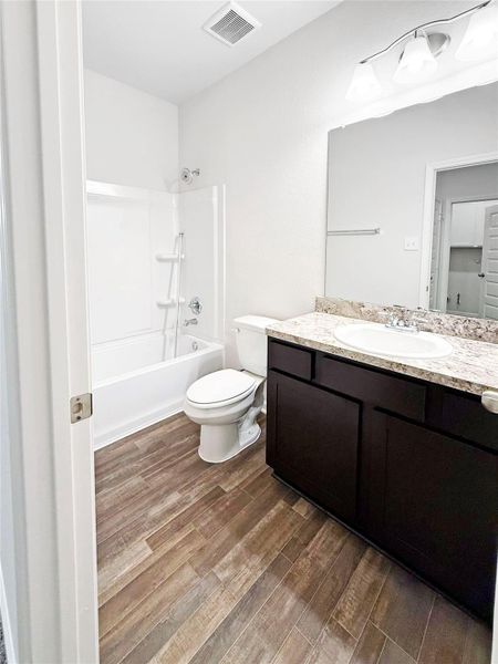 Furnished interior view inside a new home in Sierra Vista, Iowa Colony (Image 10).