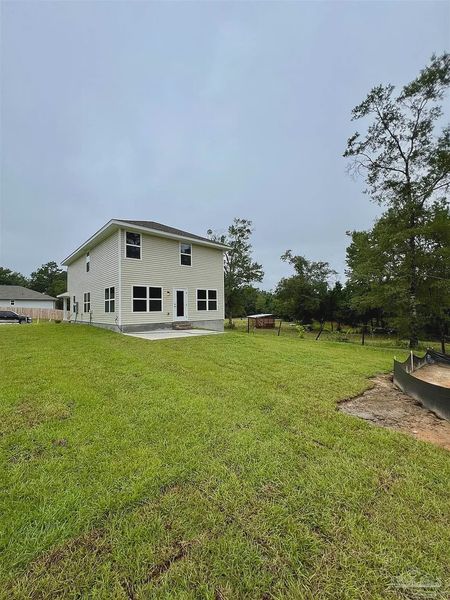 Front exterior of a new home in Pine Top, Cantonment, FL, highlighting curb appeal (Image 16).