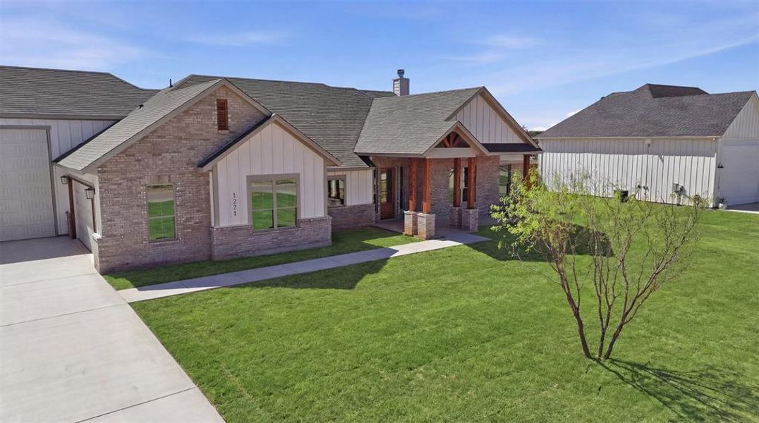 Front exterior of a new home in , Graford, TX, highlighting curb appeal (Image 20).