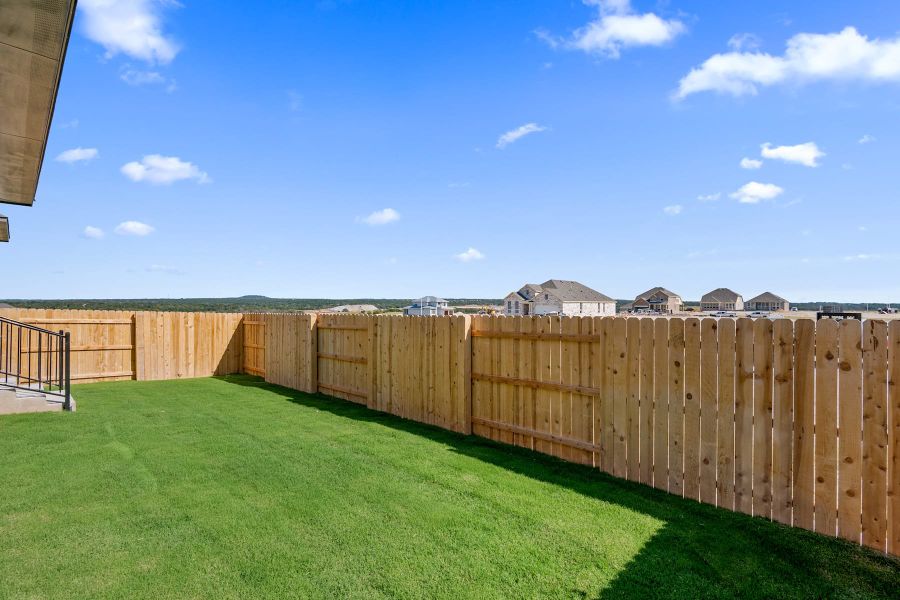 Exterior details and patio area of a home in Lariat, Liberty Hill (Image 28).