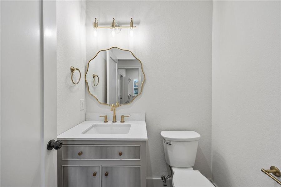 Bathroom with vanity and toilet