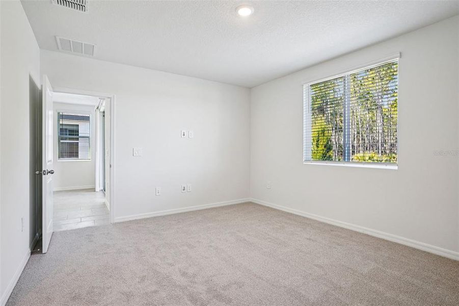 Spacious, unfurnished interior of a new home in Ridgehaven - Villas, Ormond Beach (Image 37).