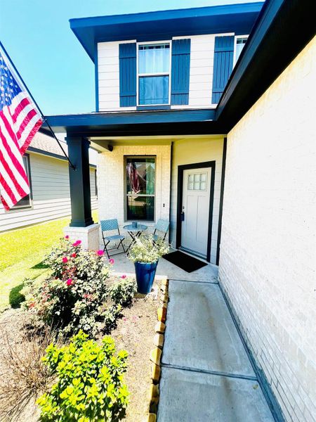 Exterior details and patio area of a home in Bluebonnet Village, Bellville (Image 24).