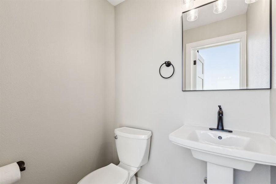 Bathroom with toilet and a sink Bathroom with toilet and a sink