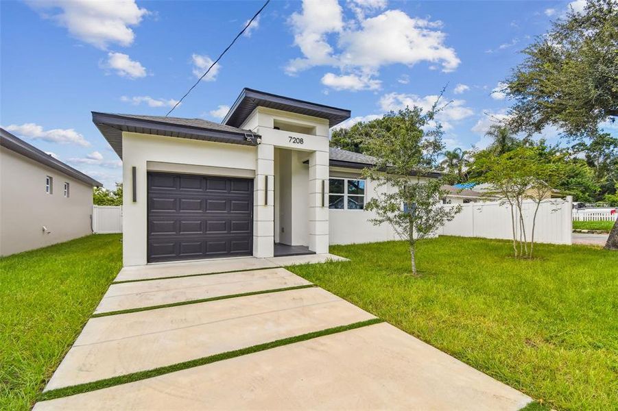 Front exterior of a new home in , Tampa, FL, highlighting curb appeal (Image 39).