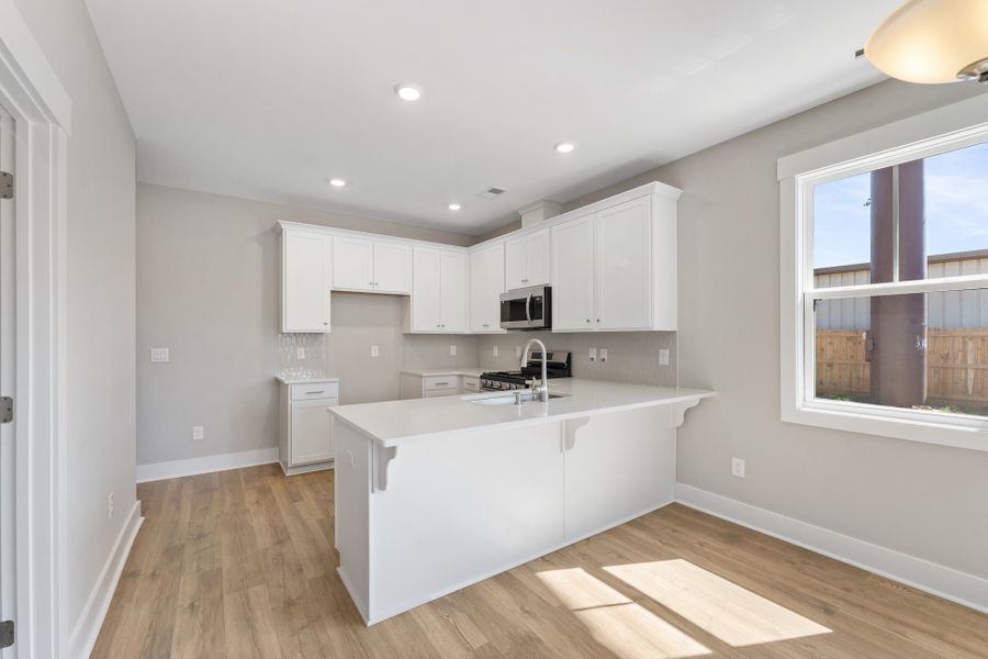 Representative furnished interior of a home built from the Holland by Hunter Quinn Homes in Renaissance Place, Greenville (Image 6).