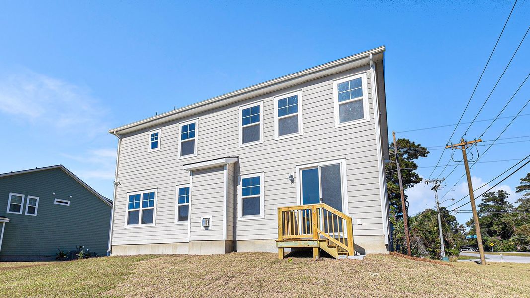 Exterior details and patio area of a home in Belle Park, North Myrtle Beach (Image 3).