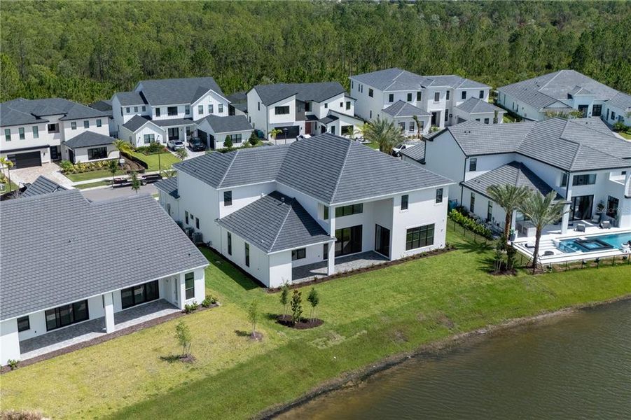 Front exterior of a new home in , Orlando, FL, highlighting curb appeal (Image 27).