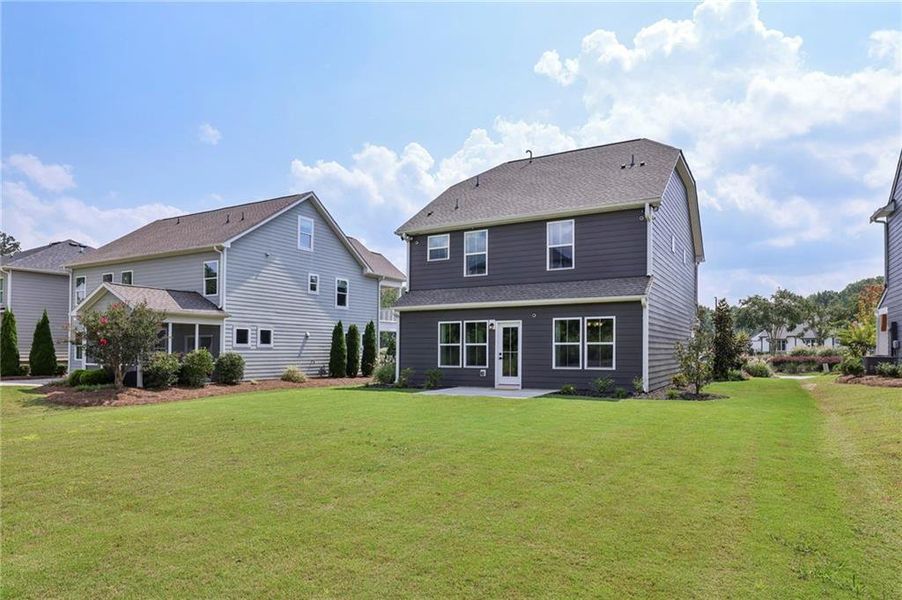 Front exterior of a new home in , Hoschton, GA, highlighting curb appeal (Image 18).