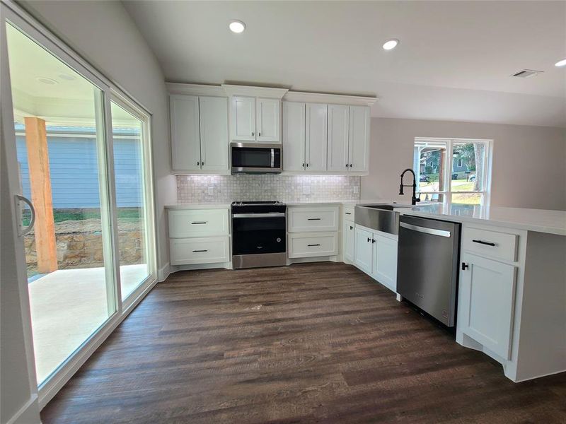 Sliding glass door to access covered back patio