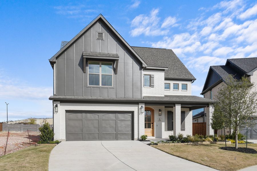 Front exterior of a new home in Aster Park, McKinney, TX, highlighting curb appeal (Image 1). Front exterior of a new home in Aster Park, McKinney, TX, highlighting curb appeal (Image 1).
