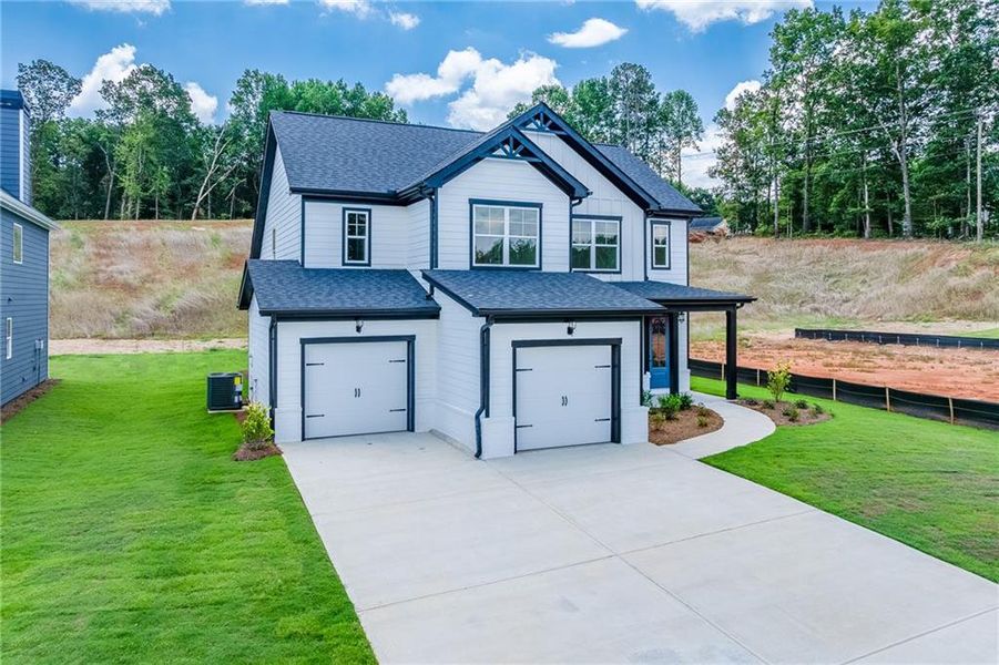 Front exterior of a new home in , Homer, GA, highlighting curb appeal (Image 17).