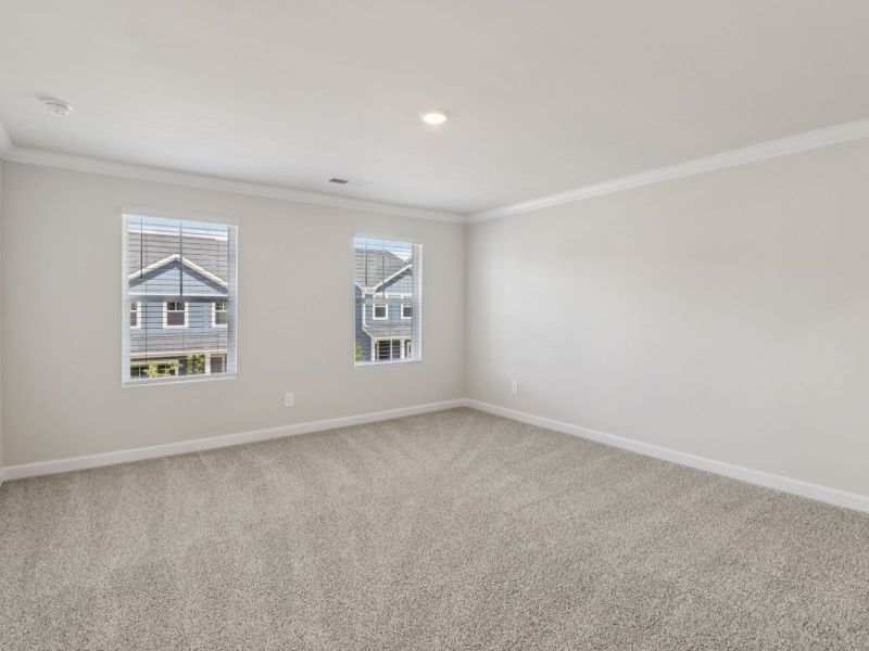 Relax and unwind after a long day in the spacious primary bedroom. Relax and unwind after a long day in the spacious primary bedroom.