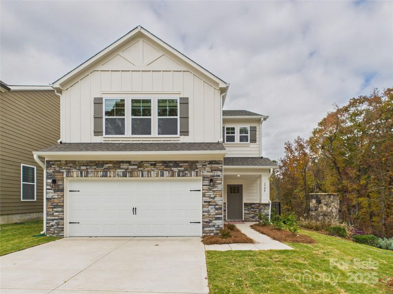 Front exterior of a new home in Kinghurst Cove, Charlotte, NC, highlighting curb appeal (Image 2). Front exterior of a new home in Kinghurst Cove, Charlotte, NC, highlighting curb appeal (Image 2).