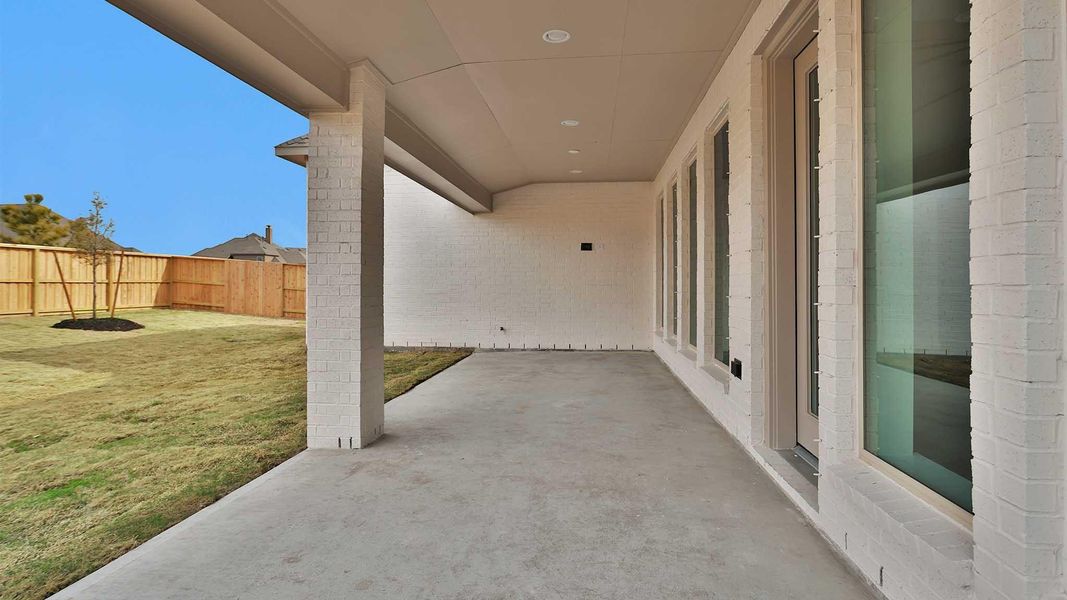 Exterior details and patio area of a home in Meridiana, Manvel (Image 3).