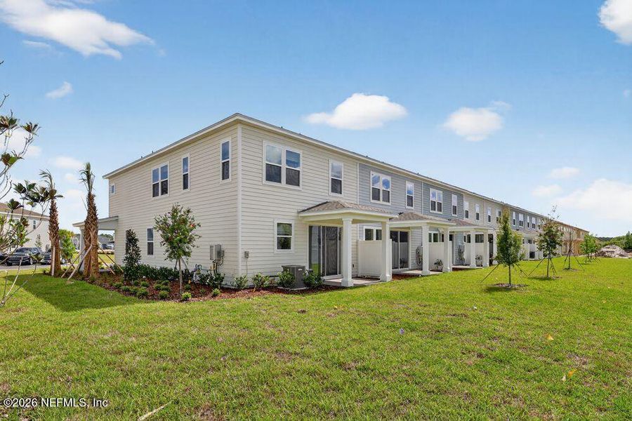 Exterior details and patio area of a home in Cherry Elm at SilverLeaf, St. Augustine (Image 21).