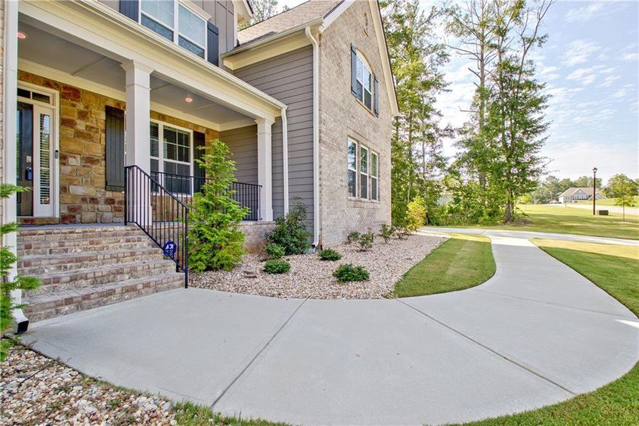 Front exterior of a new home in Genesee, Newnan, GA, highlighting curb appeal (Image 24).