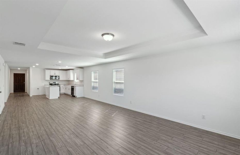 Airy gathering room with tray ceiling *real home pictured