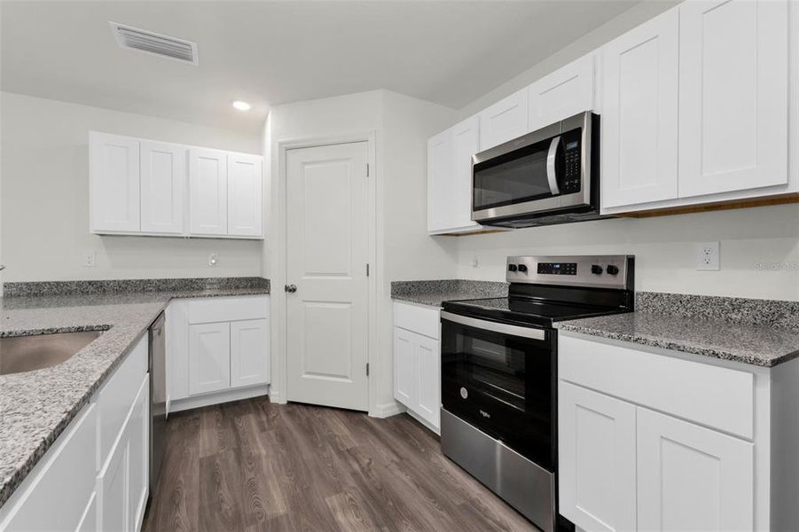 Furnished interior view inside a new home in , Port Charlotte (Image 7).