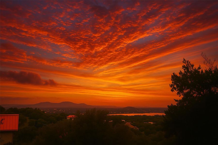Spectacular Sunset View of Packsaddle Mountain & Lake LBJ taken from the front porch.