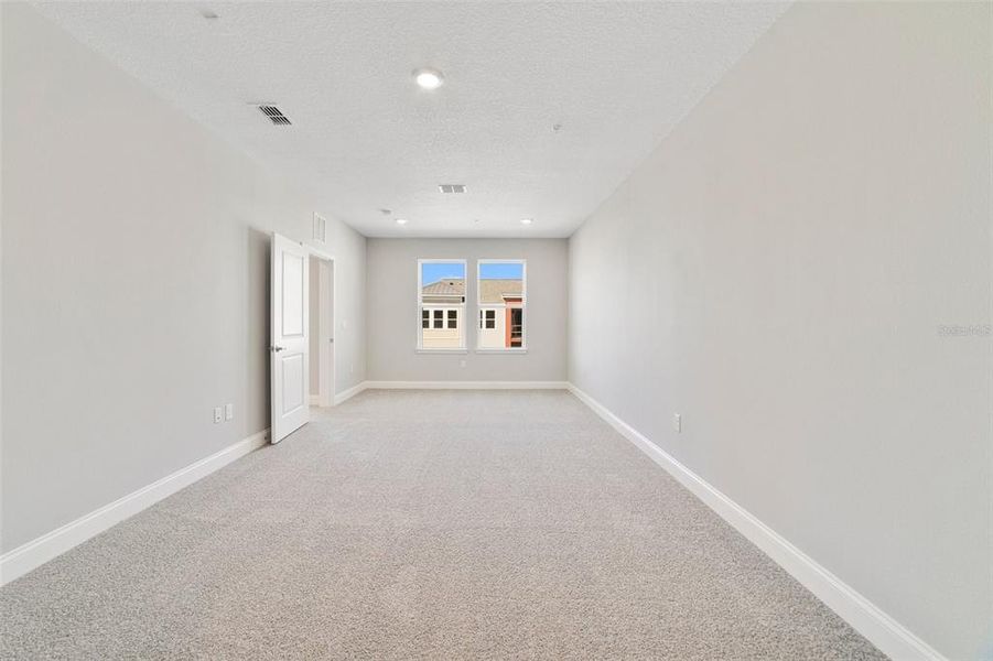 Spacious, unfurnished interior of a new home in Gatherings® of Lake Nona, Orlando (Image 22).