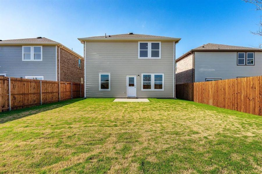 Rear view of property with a patio and a fenced backyard Rear view of property with a patio and a fenced backyard