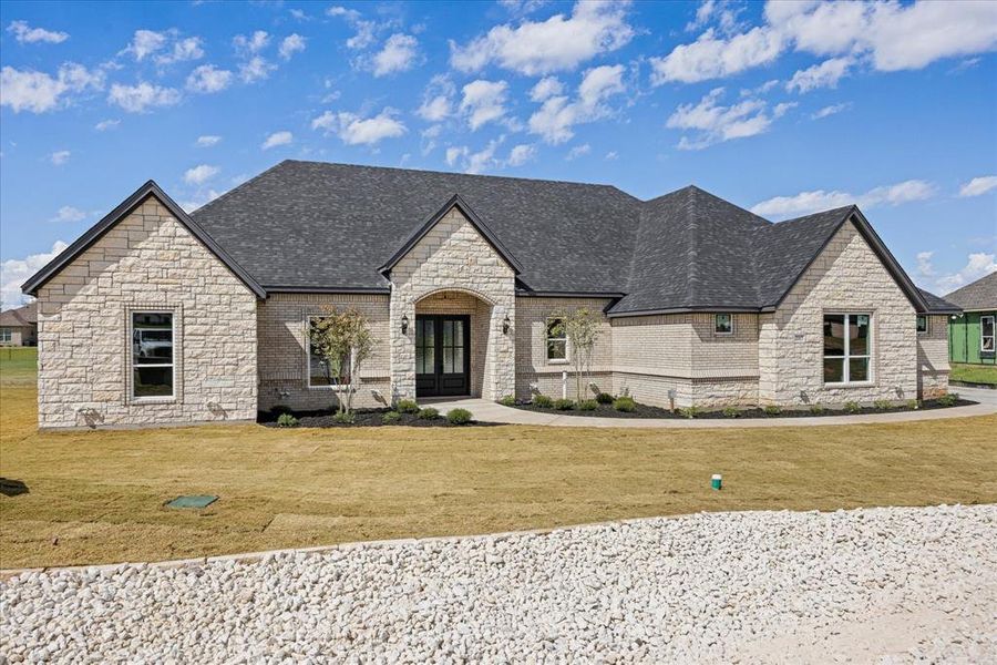 Front exterior of a new home in Pecan Plantation, Granbury, TX, highlighting curb appeal (Image 25).