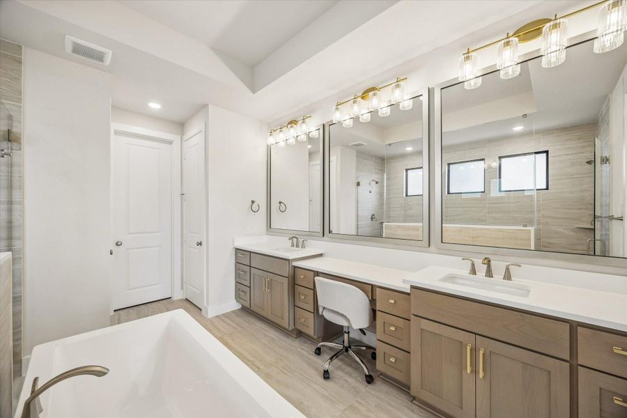 THE PRIMARY BATH INCLUDES DUAL VANITIES, GENEROUS COUNTER SPACE, AND MULTIPLE FRAMED MIRRORS WITH UPGRADED LIGHTING. THE PRIMARY BATH INCLUDES DUAL VANITIES, GENEROUS COUNTER SPACE, AND MULTIPLE FRAMED MIRRORS WITH UPGRADED LIGHTING.
