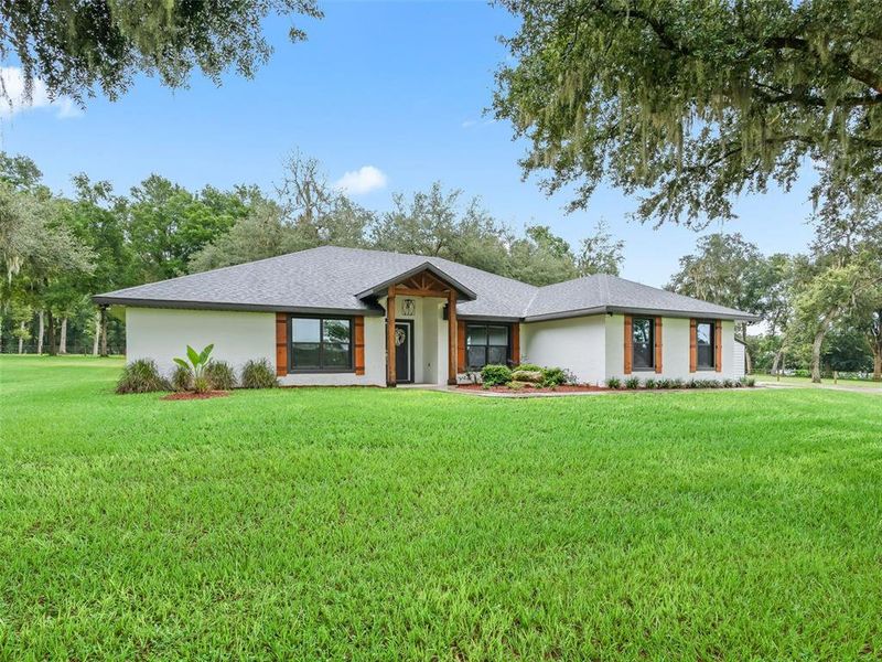 Front exterior of a new home in , Bushnell, FL, highlighting curb appeal (Image 20).