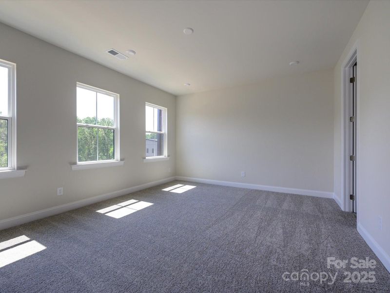 Large Primary Suite With a Wall of Windows